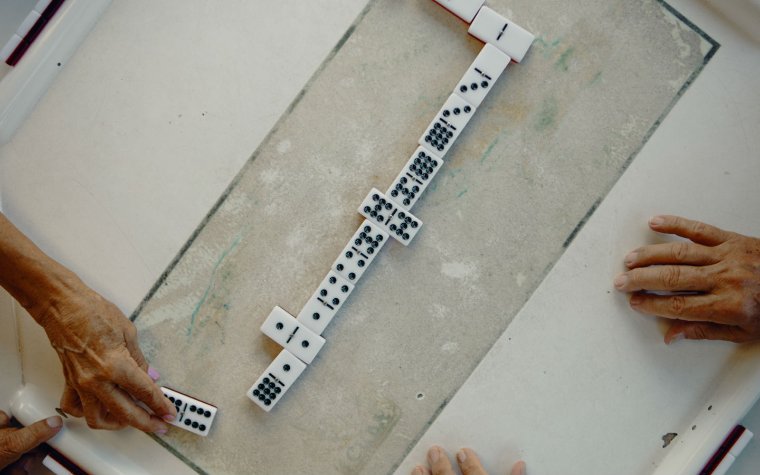 Dominoes being played at Domino Park Dominoes being played at Domino Park