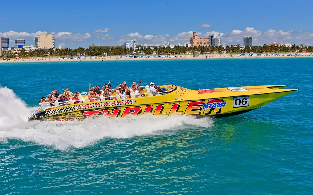 Thriller's yellow speedboat with tour group on the water