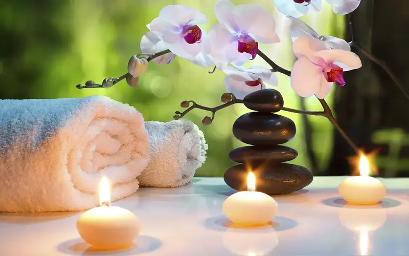 Spa candles, rocks and towels