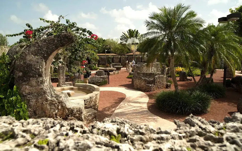 Visitors in Coral Castle's sculpture garden