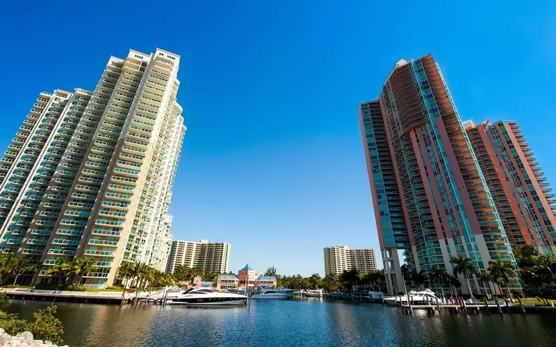 Boating channel in Aventura lined with waterfront buildings