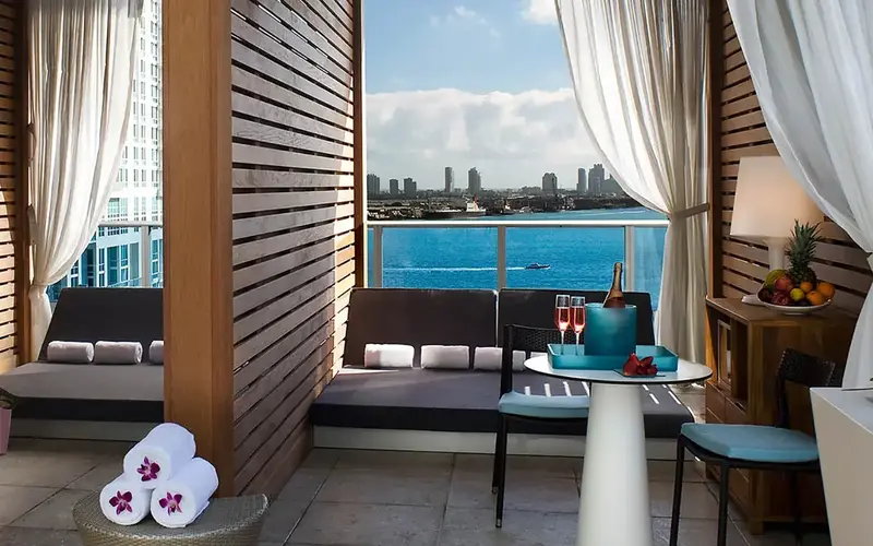 Pool cabana overlooking the ocean and skyline