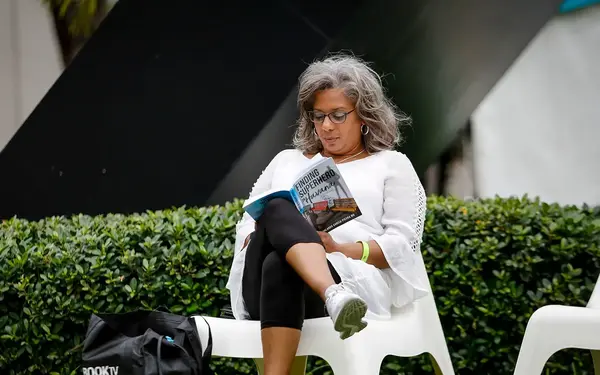 Seated lady reading book