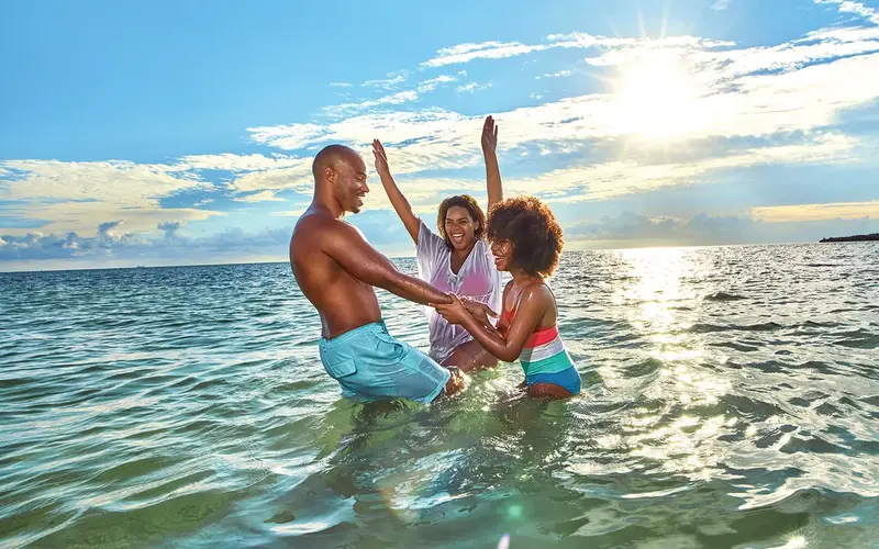 Family in the water in Historic Virginia Key Beach