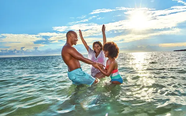 Family playing in the water