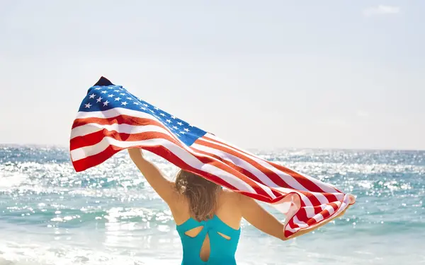 Lady with Flag at the Beach
