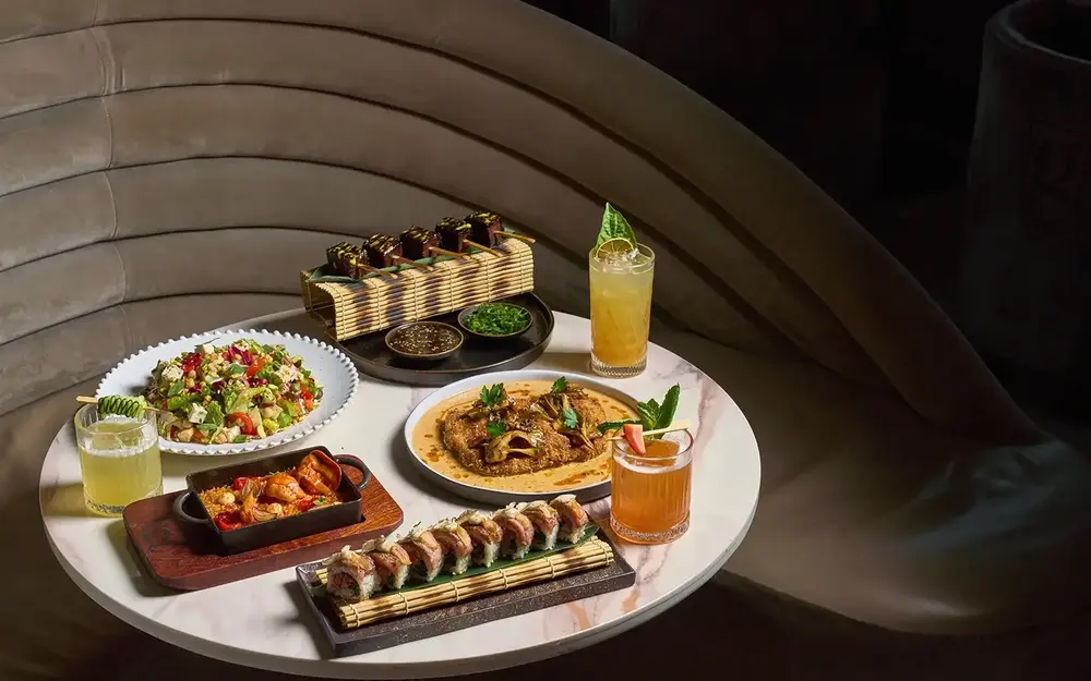 Table spread with various dishes at Giselle Restaurant