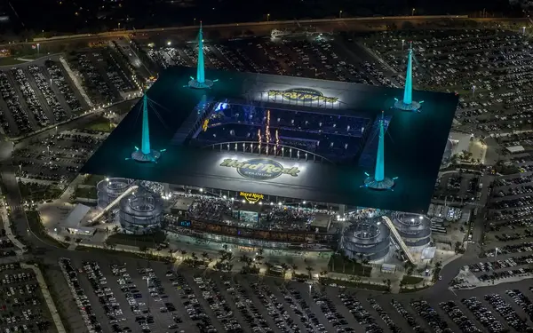 Hard Rock Stadium's glowing spires at night
