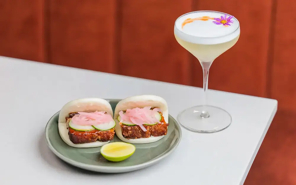 Pork belly bao and cocktail at La Brisa restaurant