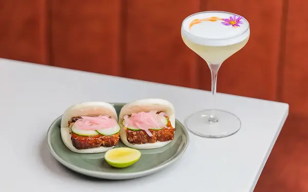 Pork belly bao and cocktail at La Brisa restaurant
