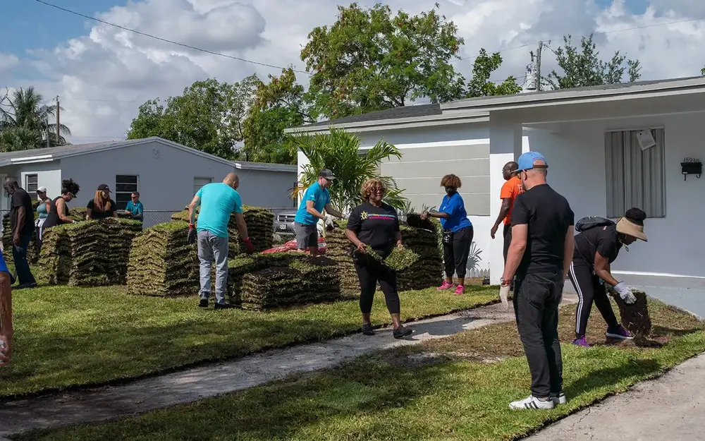 GMCVB Team placing new sod at a home in Miami Gardens