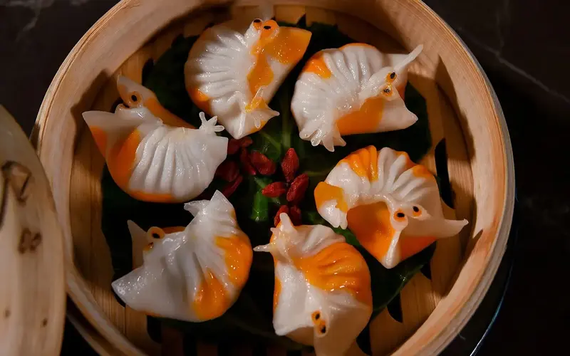 Hakkasan's steamed crystal lobster served in a bamboo steamer