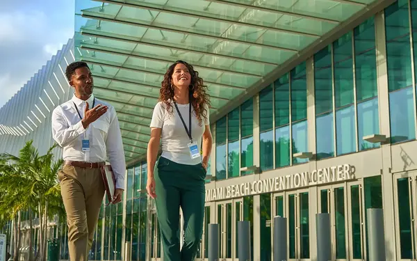 Meeting attendees in front of the Miami Beach Convention Center