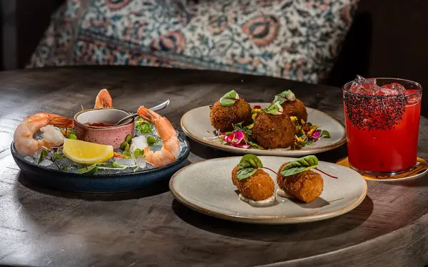 Glass of wine served dishes at Vinya Table