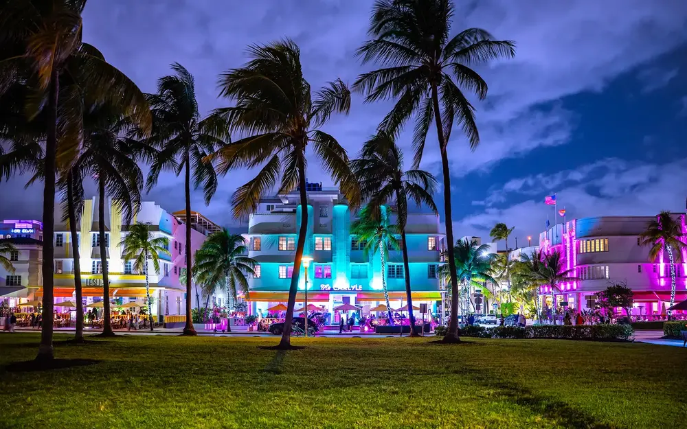 Art Deco hotels glowing on Ocean Drive at night