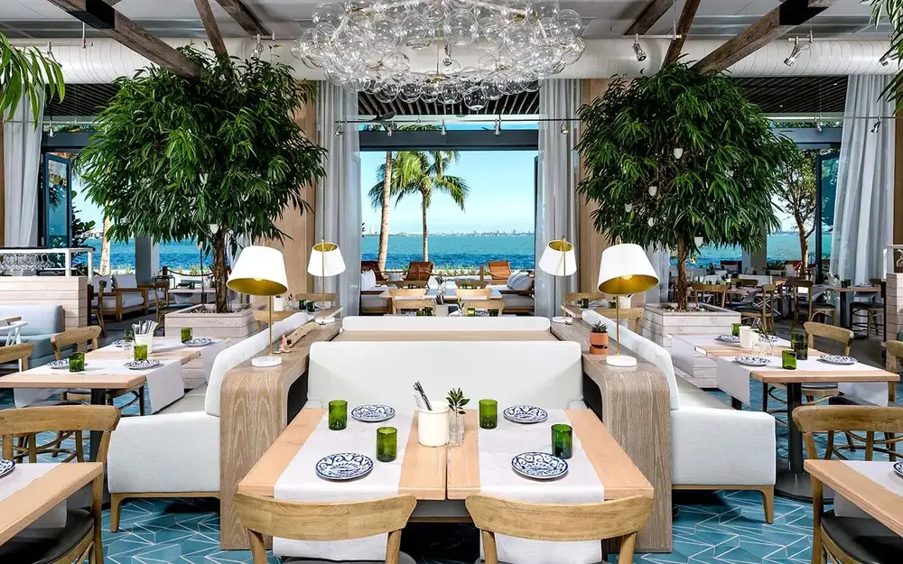Dining room with water view at Amara at Paraiso