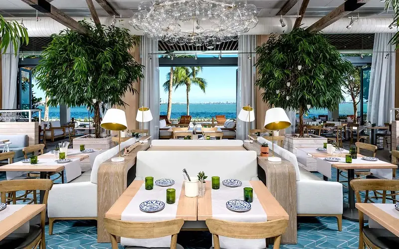 Dining room with water view at Amara at Paraiso