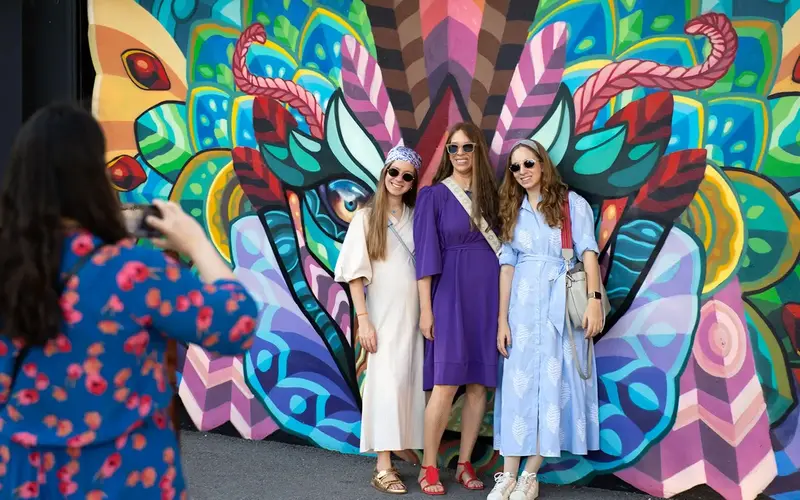 3 ladies posing by a Wynwood Walls mural