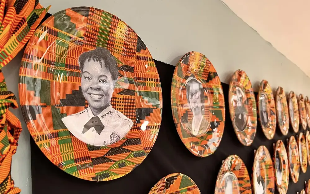 Wall full of colorful plates at Black Police Precinct Museum