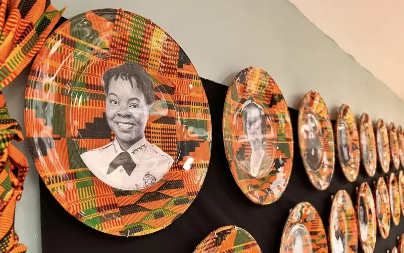 Wall full of colorful plates at Black Police Precinct Museum