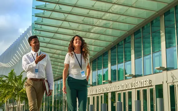 Meeting attendees outside of the Miami Beach Convention Center