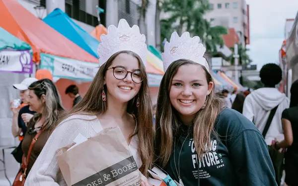Girls wearing crowns at the Street Fair