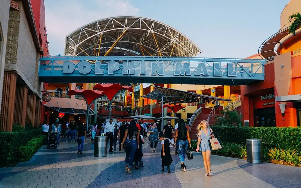 Shoppers by Dolphin Mall's entrance