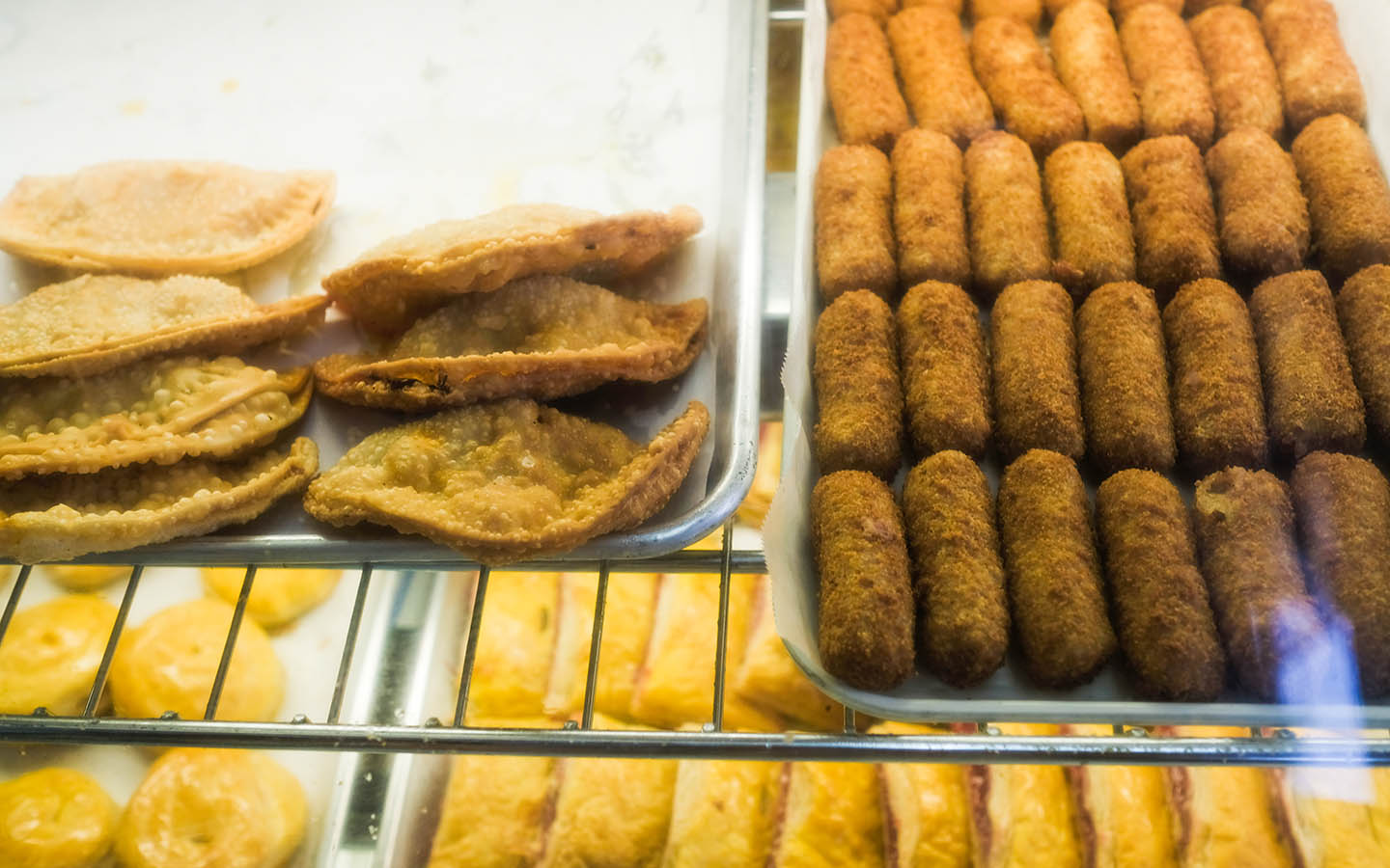 Croquetas being displayed, finger-sized logs of mashed ham