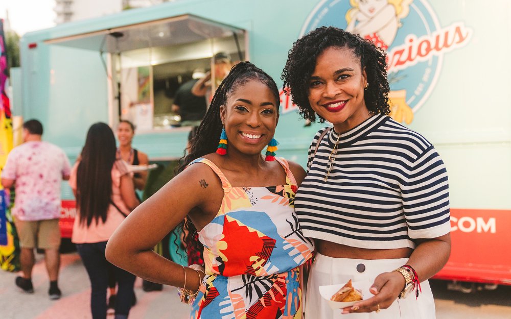 Ladies next to Ms. Cheezious, Courtesy of SOBEWFF®️