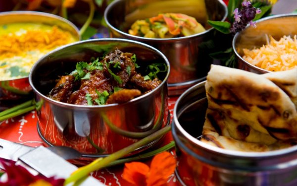 Ghee's meals presented in stainless steel bowls