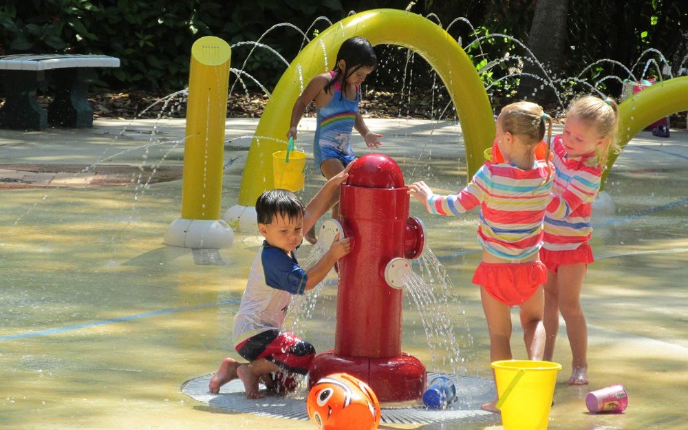 Children playing at Splash 'N Play playground in Pinecrest Gardens