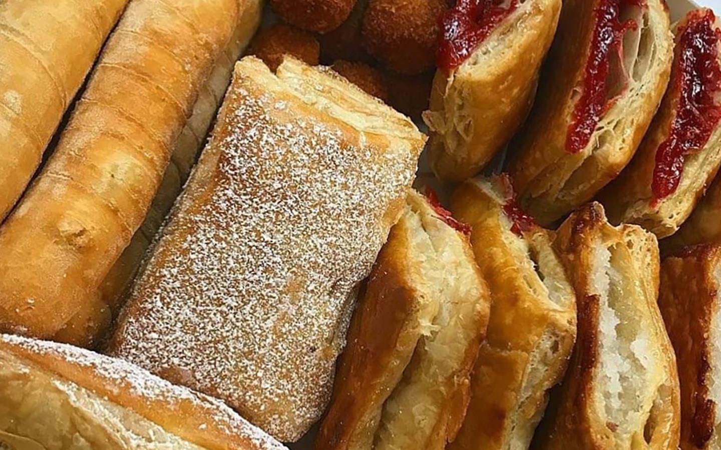 Assortment of freshly baked pastries at Breadman Miami, showcasing a variety of flavors and textures Assortment of freshly baked pastries at Breadman Miami, showcasing a variety of flavors and textures