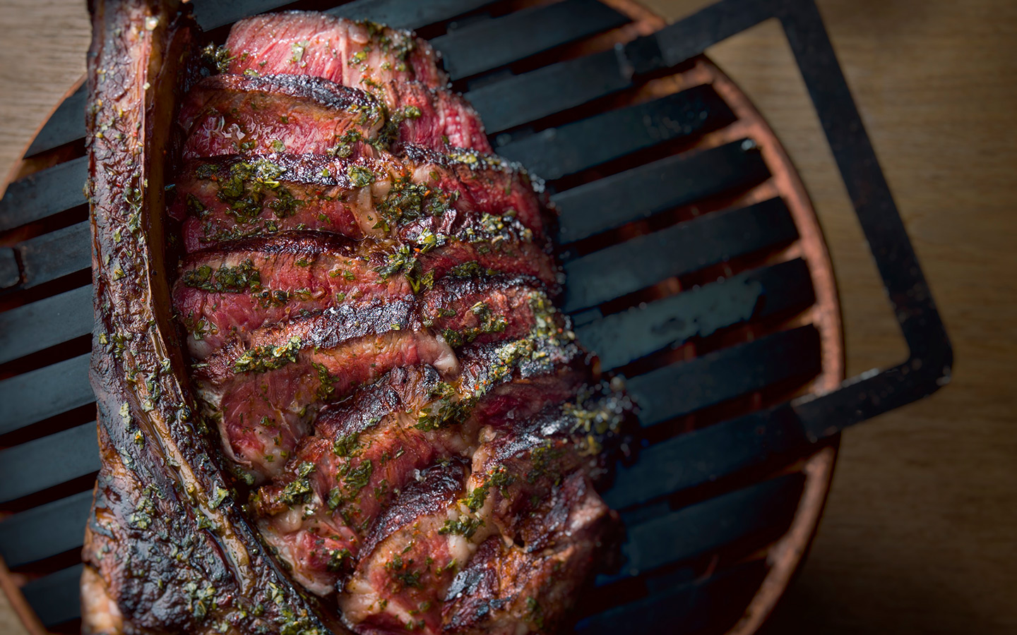 Hanging ribeye at Los Fuegos, by Juan Fernando Ayora