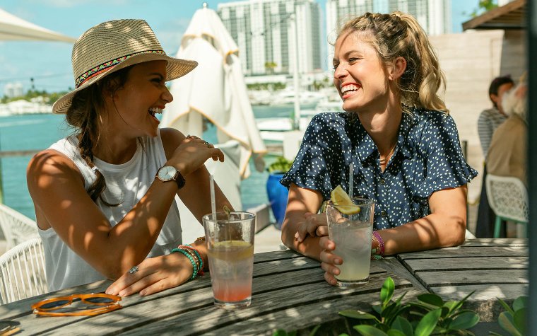 Women enjoying a drink at Lido Bayside