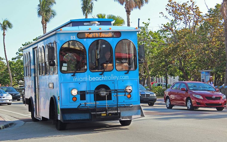 Miami Beach Trolley driving down the street Miami Beach Trolley driving down the street