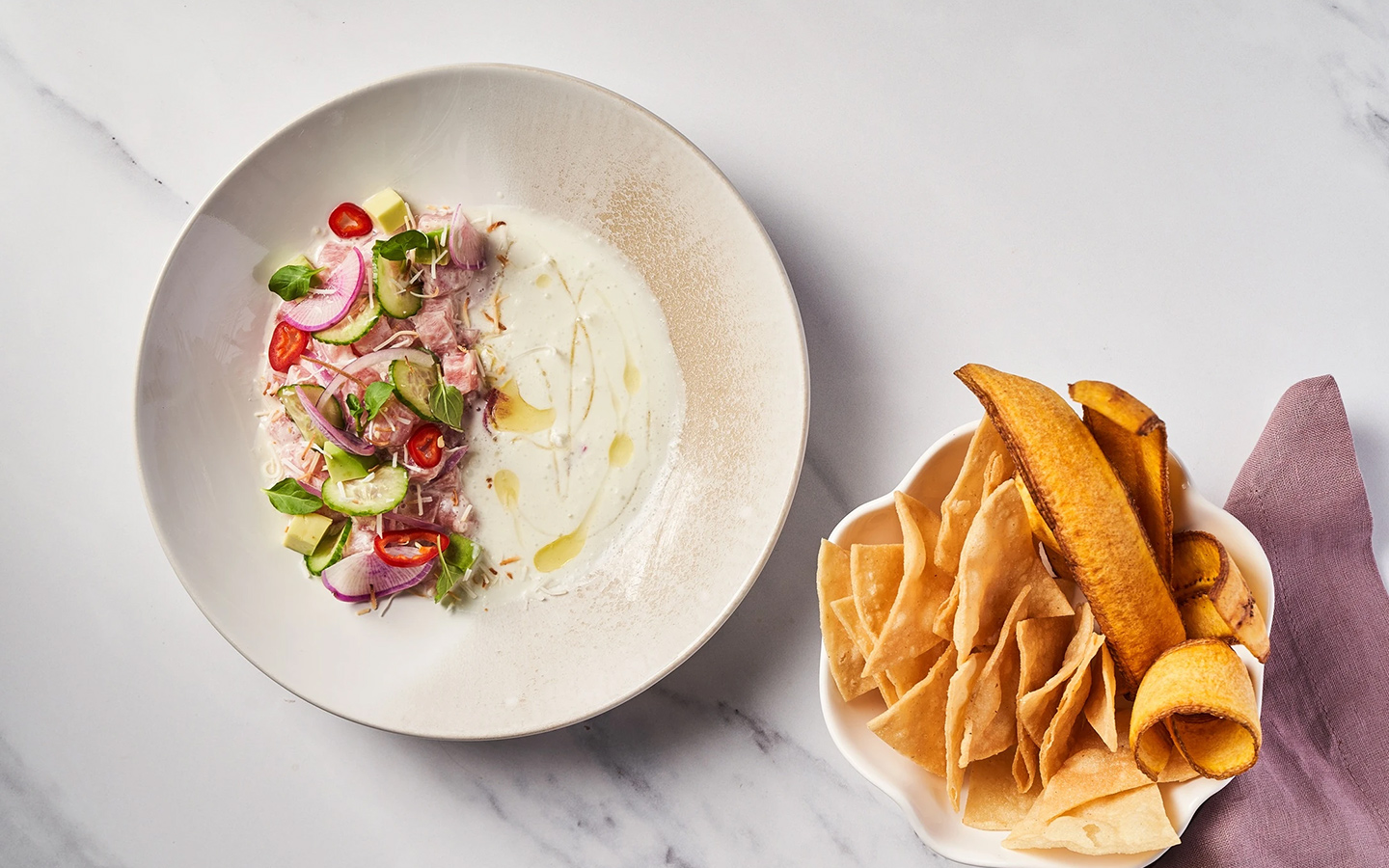Coconut tuna tiradito at Toro Toro, served with crispy bites on the side
