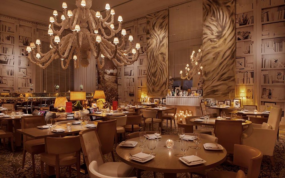 The Bazaar's whimsical chandelier hangs over the dining room