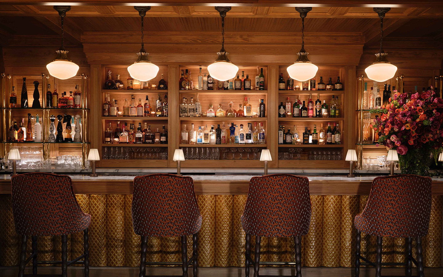 Bar at Chateau ZZ, featuring luxurious seating, soft lighting, and a curated selection of premium beverages