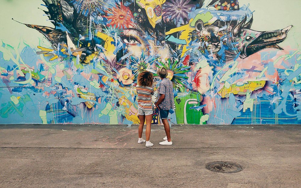 Couple admiring a mural in the Wynwood Walls