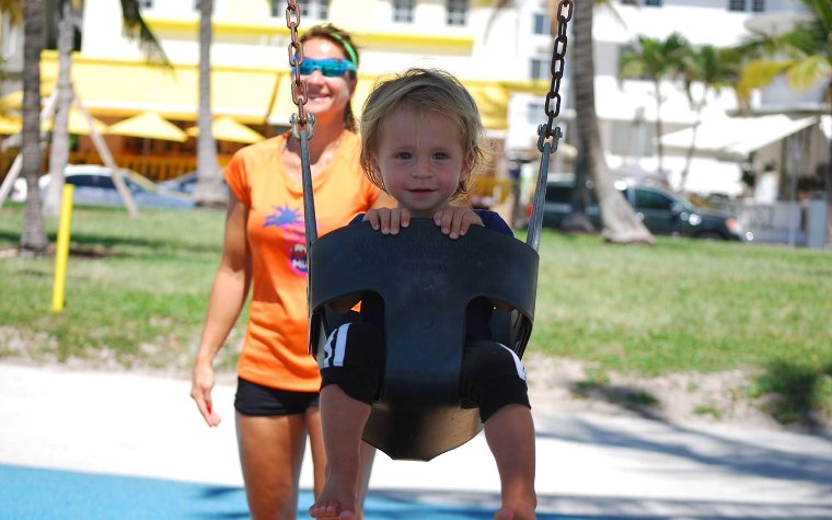 Child on a swing at Lummus Park Child on a swing at Lummus Park