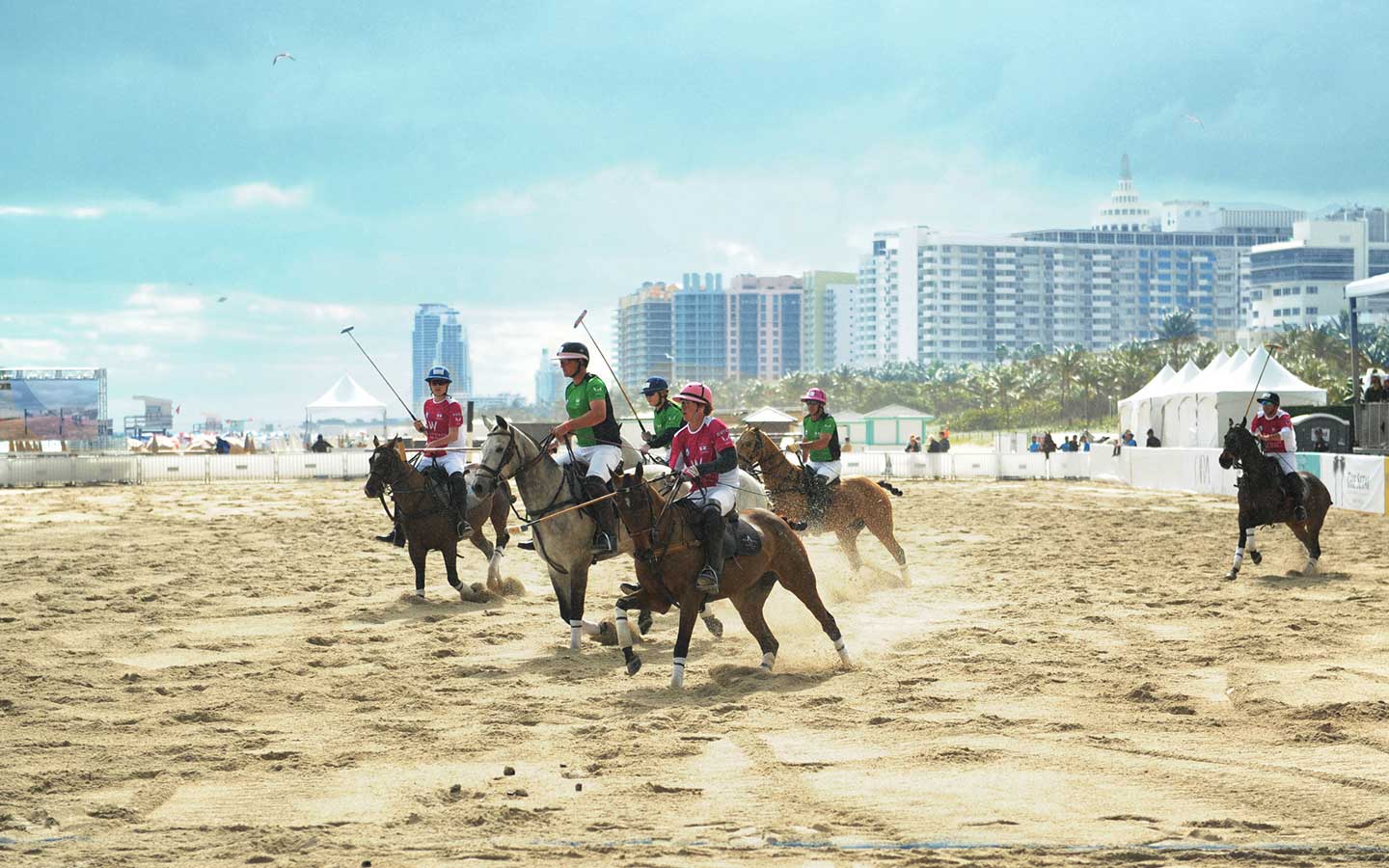 Polo players on their horses on the sands of Miami Beach
