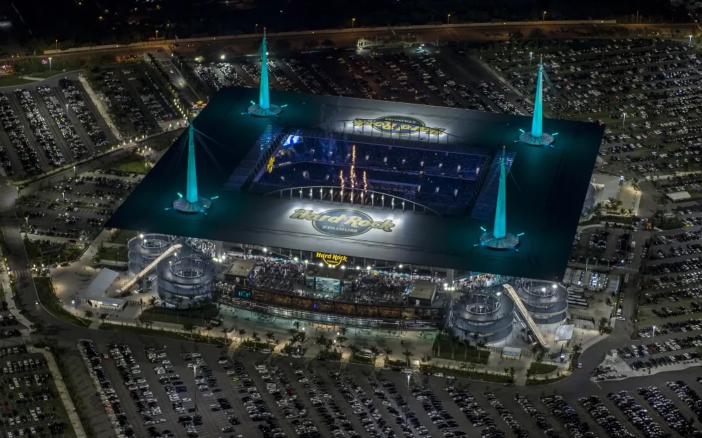 Hard Rock Stadium's glowing spires at night