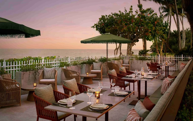 Paralia restaurant terrace with views over the water at sunset