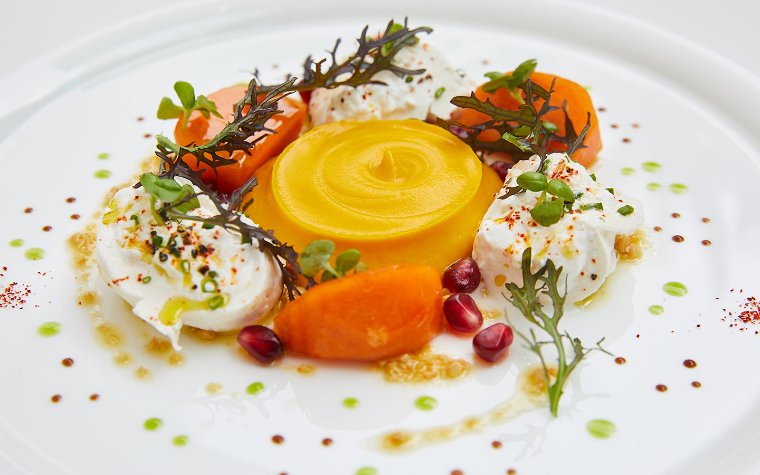 vibrant salad featuring creamy burrata, fresh greens, and colorful vegetables, served at Le Jardinier vibrant salad featuring creamy burrata, fresh greens, and colorful vegetables, served at Le Jardinier