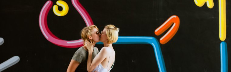 Kissing next to Typoe's mural in Wynwood Kissing next to Typoe's mural in Wynwood