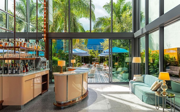 Mr. C Hotel lobby bar leading to a the terrace