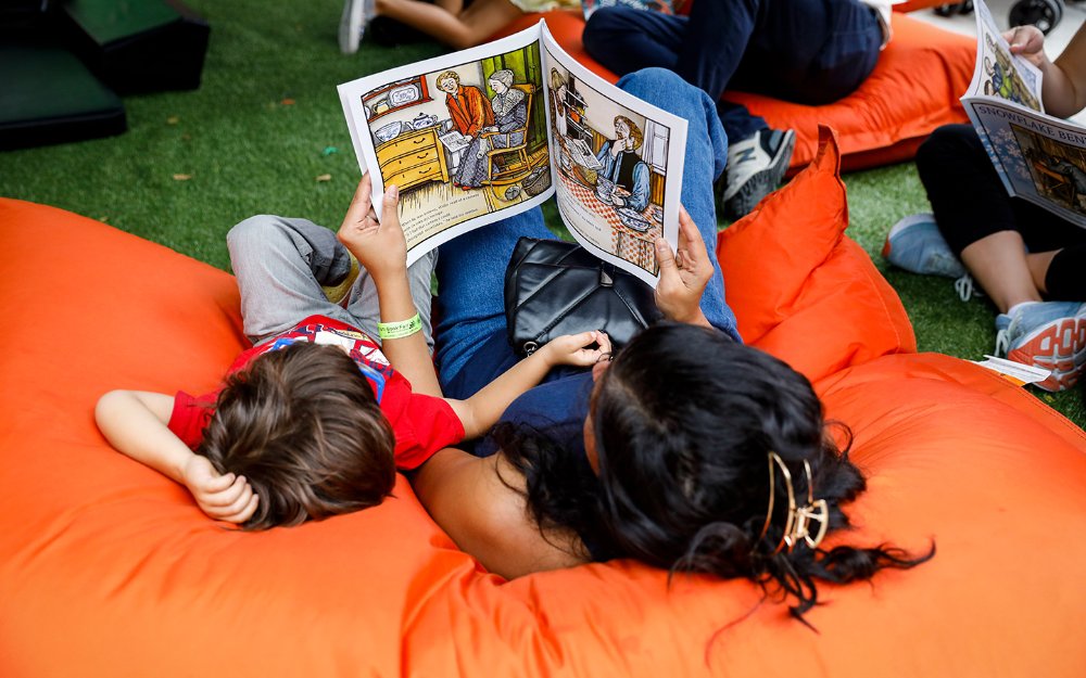 Mother and child reading at Miami Book Fair
