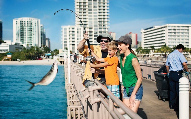 Family fishing on Sunny Isles Beach Pier Family fishing on Sunny Isles Beach Pier