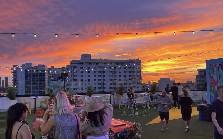 Sunset at Rooftop Cinema with tables set up