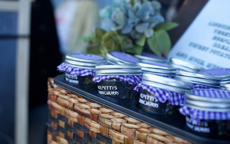 Jars of chimichurri displayed in a basket Jars of chimichurri displayed in a basket